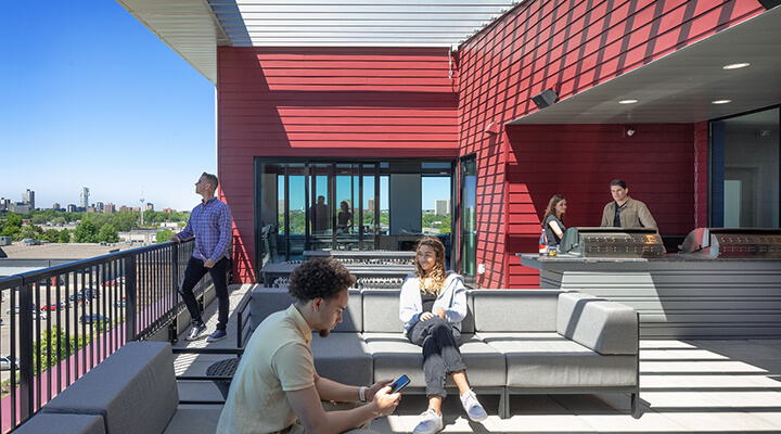 Everlake rooftop patio with lounge seating, grilling area, and city views