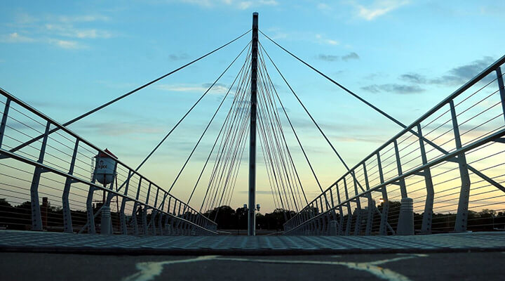 Martin Olav Sabo Bridge at dusk with cable supports and pedestrian walkway